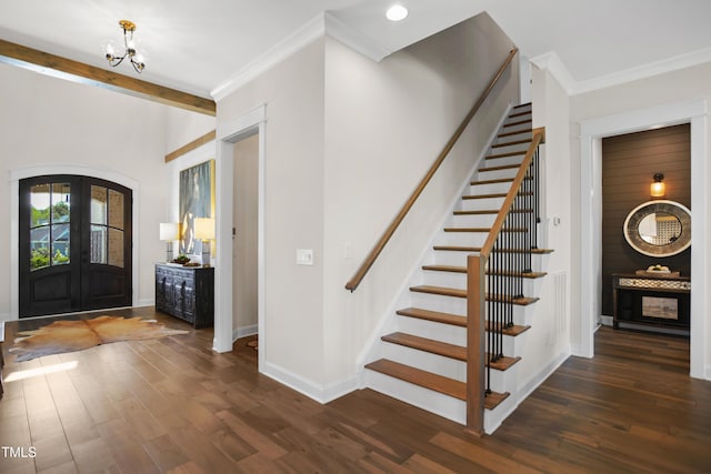 241 Teague St, Wake Forest, NC 27587 - entrance foyer with stairs, french doors, dark wood finished floors, a chandelier, and crown molding