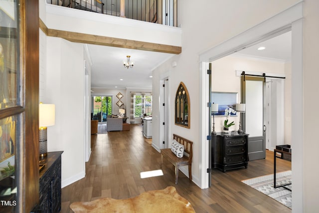 241 Teague St, Wake Forest, NC 27587 - foyer featuring a barn door, wood finished floors, ornamental molding, a chandelier, and recessed lighting