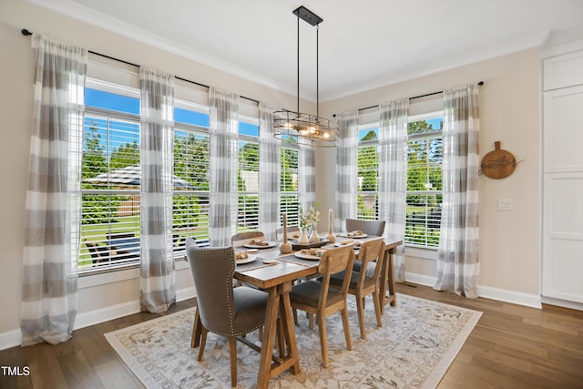 241 Teague St, Wake Forest, NC 27587 - dining space with wood finished floors, a chandelier, and ornamental molding