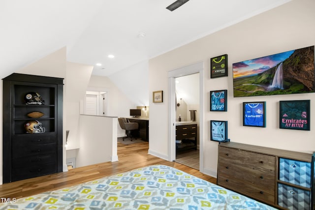 241 Teague St, Wake Forest, NC 27587 - bedroom featuring wood finished floors, a desk, ensuite bathroom, lofted ceiling, and recessed lighting