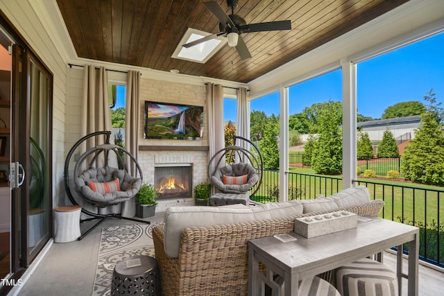 241 Teague St, Wake Forest, NC 27587 - sunroom / solarium featuring ornamental molding, wood ceiling, a ceiling fan, a skylight, and plenty of natural light
