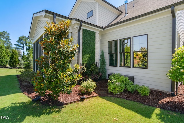 241 Teague St, Wake Forest, NC 27587 - view of home's exterior with a yard and roof with shingles