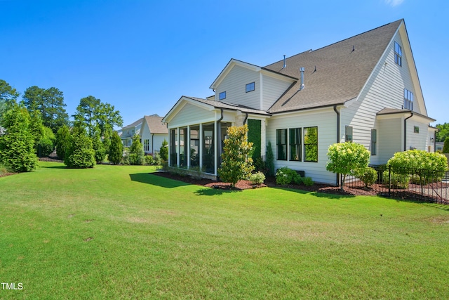 241 Teague St, Wake Forest, NC 27587 - back of property with a sunroom and a shingled roof