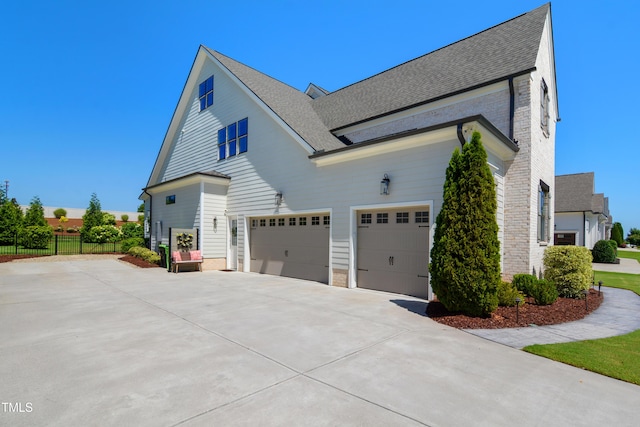 241 Teague St, Wake Forest, NC 27587 - view of home's exterior featuring concrete driveway, an attached garage, and roof with shingles