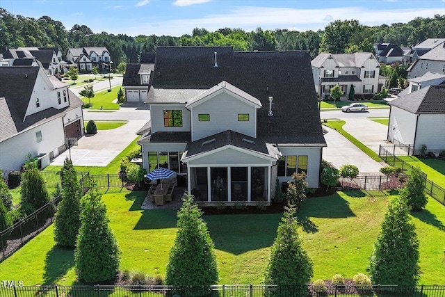 241 Teague St, Wake Forest, NC 27587 - back of house with a residential view, a sunroom, and a fenced backyard