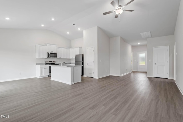 3837 Ava Dr, Bailey, NC 27807 - unfurnished living room with a ceiling fan, lofted ceiling, wood finished floors, and recessed lighting