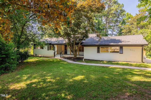 944 Athens Dr, Raleigh, NC 27606 - view of front of home with a front yard and roof with shingles