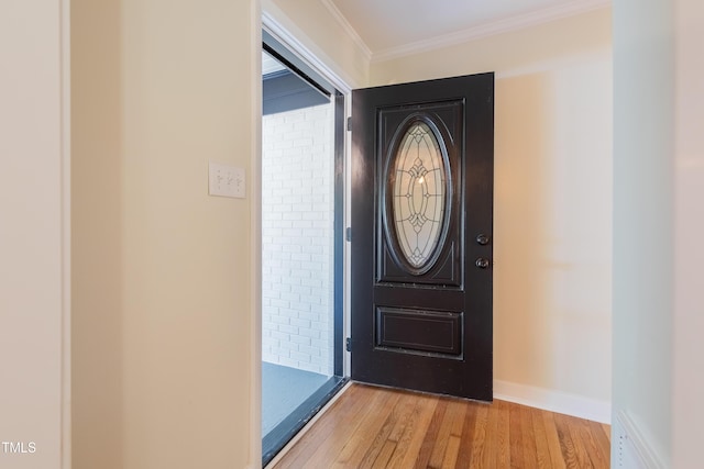 944 Athens Dr, Raleigh, NC 27606 - entryway with light wood-style flooring and ornamental molding
