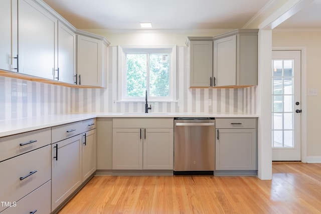 944 Athens Dr, Raleigh, NC 27606 - kitchen featuring dishwasher, gray cabinetry, ornamental molding, light wood-type flooring, and tasteful backsplash