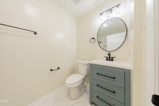 944 Athens Dr, Raleigh, NC 27606 - bathroom with marble look tile flooring and vanity