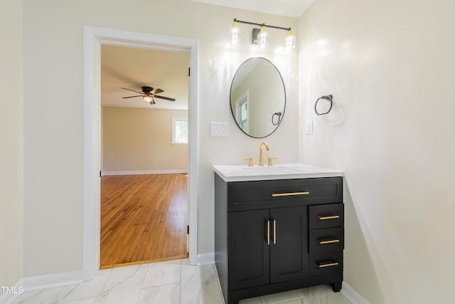 944 Athens Dr, Raleigh, NC 27606 - bathroom featuring vanity, ceiling fan, and marble finish floors
