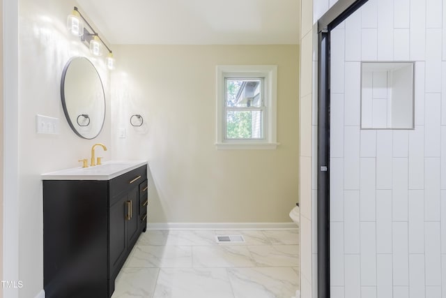 944 Athens Dr, Raleigh, NC 27606 - full bath featuring vanity, marble finish floors, and an enclosed shower