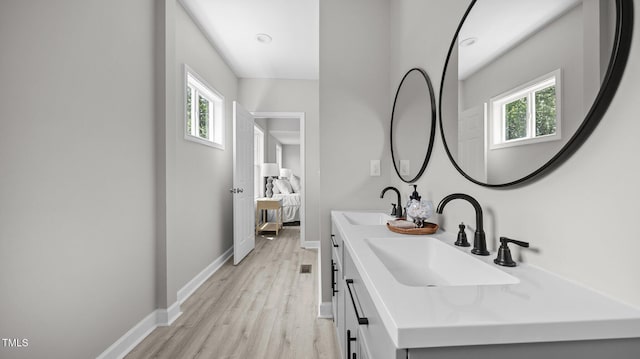 505 Hawfields Rd, Mebane, NC 27302 - ensuite bathroom with healthy amount of natural light, double vanity, and wood finished floors
