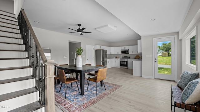 505 Hawfields Rd, Mebane, NC 27302 - dining area featuring stairs, light wood-style flooring, and a ceiling fan