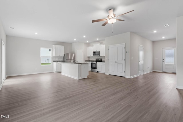 8960 Ava Dr, Bailey, NC 27807 - unfurnished living room with a ceiling fan, recessed lighting, and light wood-style floors