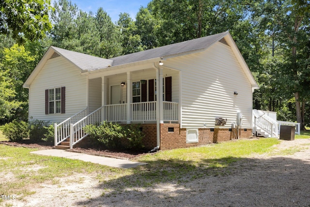 119 Percheron Dr, Zebulon, NC 27597 - ranch-style home featuring a porch, stairs, and roof with shingles