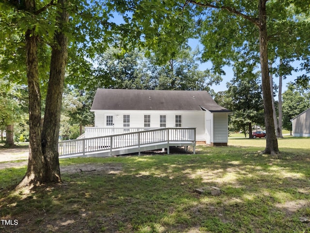 119 Percheron Dr, Zebulon, NC 27597 - rear view of house with a deck and a yard