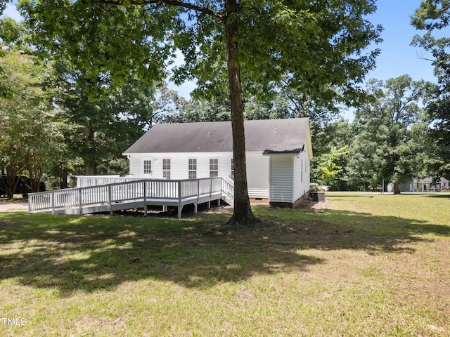 119 Percheron Dr, Zebulon, NC 27597 - back of house with a yard, a deck, crawl space, and view of wooded area
