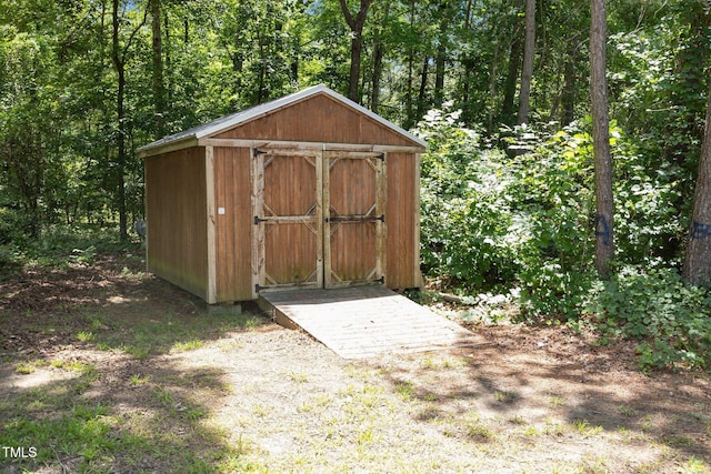 119 Percheron Dr, Zebulon, NC 27597 - view of shed with a forest view