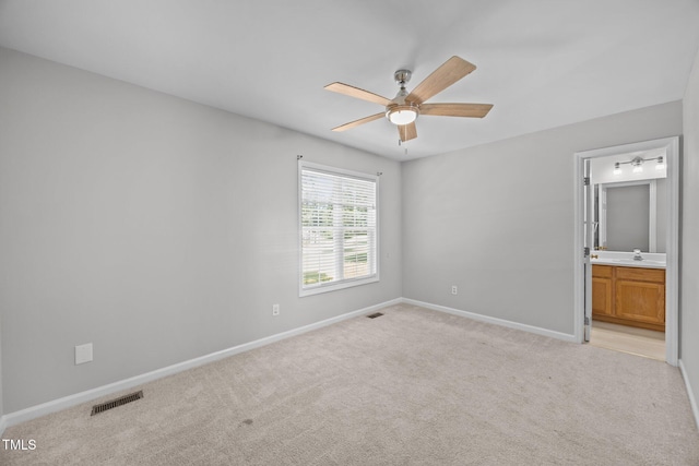 119 Percheron Dr, Zebulon, NC 27597 - unfurnished bedroom with light carpet, ensuite bath, and a ceiling fan