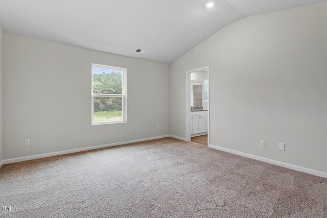 3930 Needham Rd, Bailey, NC 27807 - unfurnished room with light carpet and vaulted ceiling