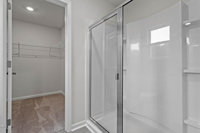 3930 Needham Rd, Bailey, NC 27807 - bathroom with a walk in closet and a stall shower