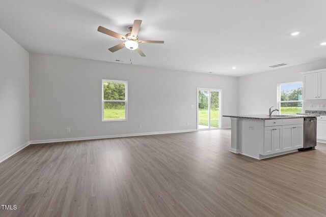 3930 Needham Rd, Bailey, NC 27807 - unfurnished living room featuring ceiling fan, wood finished floors, healthy amount of natural light, and recessed lighting