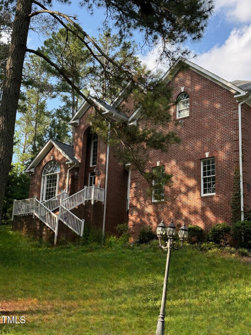 3689 Graham Sherron Rd, Wake Forest, NC 27587 - view of side of property featuring brick siding and a lawn