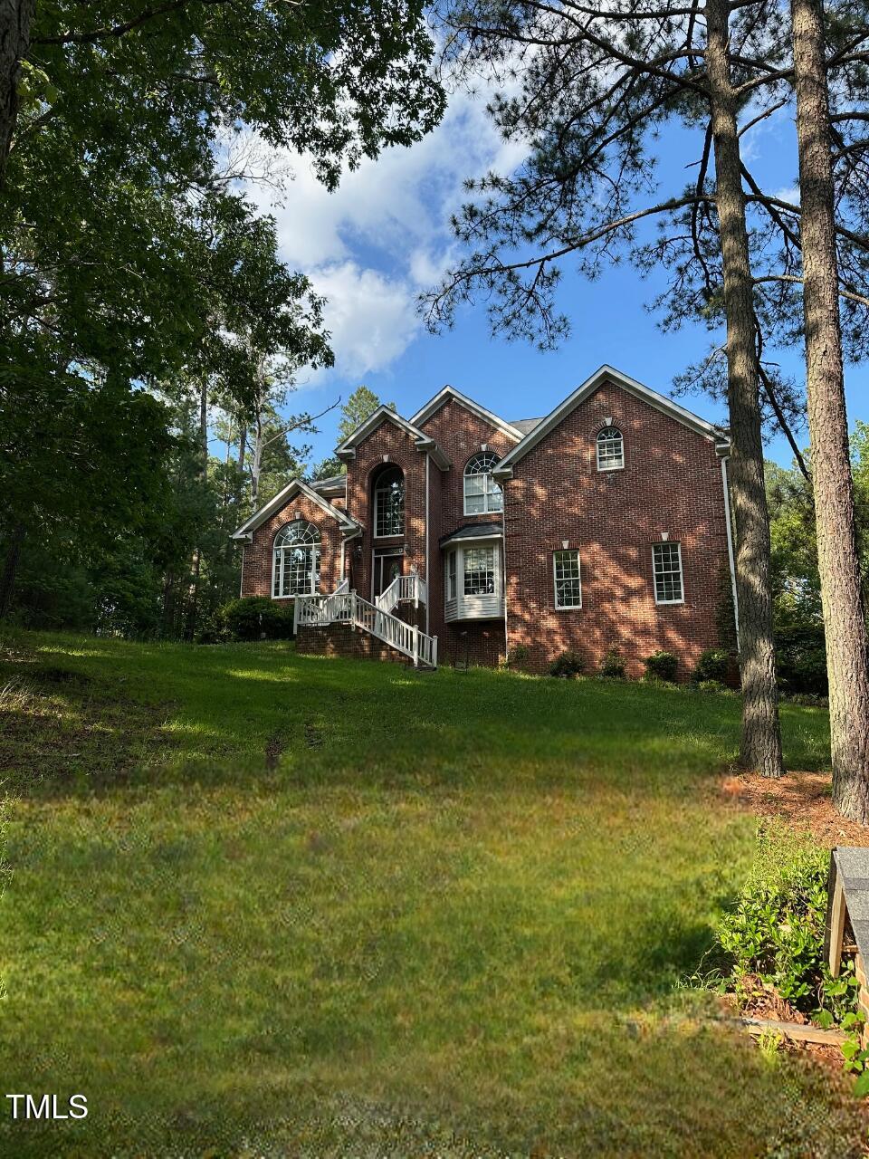 3689 Graham Sherron Rd, Wake Forest, NC 27587 - view of front of property with brick siding and a front yard