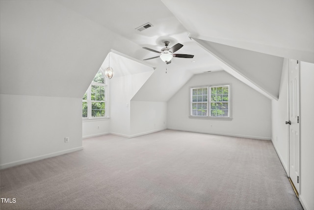 5940 Dahlberg Dr, Raleigh, NC 27603 - additional living space featuring carpet flooring, a ceiling fan, plenty of natural light, and lofted ceiling