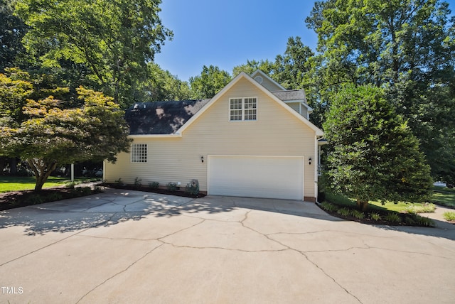 5940 Dahlberg Dr, Raleigh, NC 27603 - view of property exterior with driveway and an attached garage