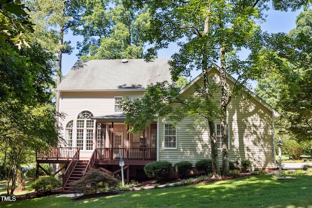 5940 Dahlberg Dr, Raleigh, NC 27603 - rear view of house with a sunroom, stairway, a wooden deck, and a yard