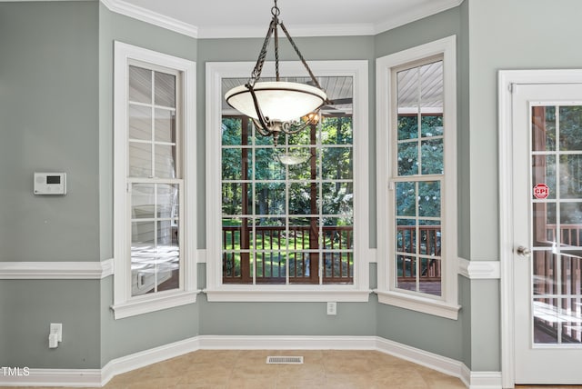 5940 Dahlberg Dr, Raleigh, NC 27603 - unfurnished dining area featuring a chandelier, tile patterned floors, and ornamental molding