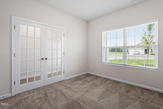 3870 Origin Dr, Bailey, NC 27807 - carpeted empty room with baseboards and french doors