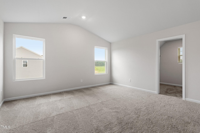 3870 Origin Dr, Bailey, NC 27807 - unfurnished bedroom with vaulted ceiling, carpet flooring, a spacious closet, and recessed lighting