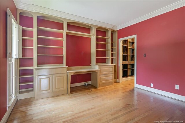 223 Devane St, Fayetteville, NC 28305 - unfurnished office with built in study area, ornamental molding, wood finished floors, and built in shelves