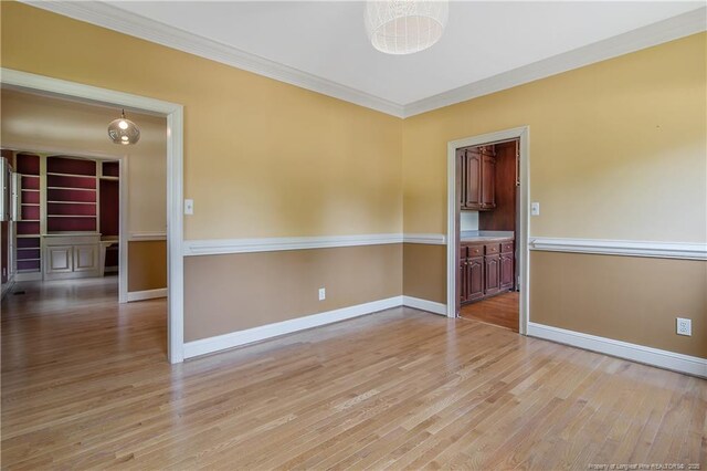 223 Devane St, Fayetteville, NC 28305 - empty room featuring ornamental molding and light wood-style floors