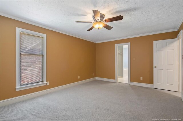 223 Devane St, Fayetteville, NC 28305 - spare room featuring a ceiling fan, light colored carpet, crown molding, and a textured ceiling