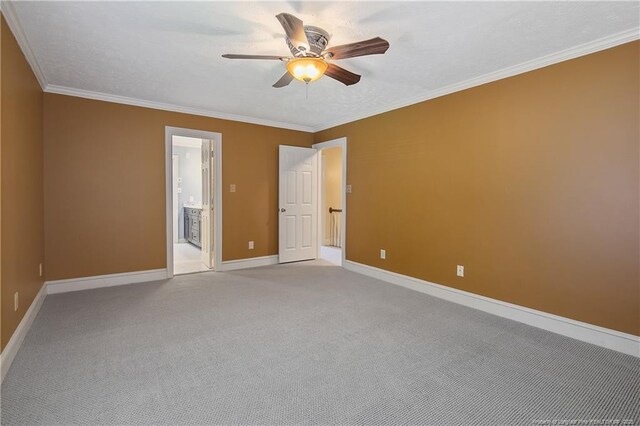 223 Devane St, Fayetteville, NC 28305 - empty room featuring a ceiling fan, light colored carpet, and crown molding