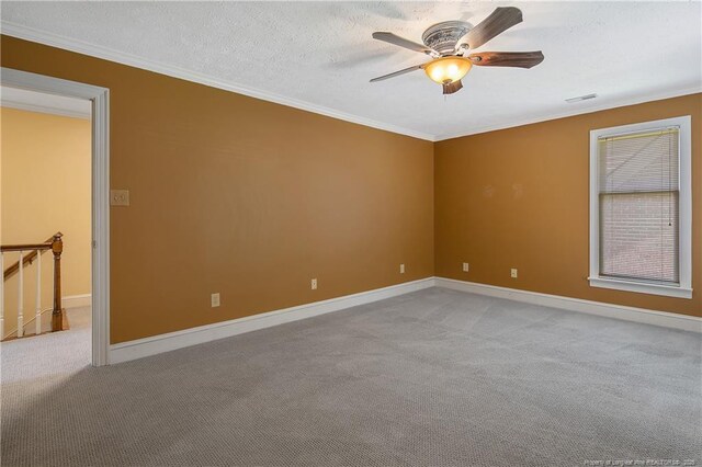 223 Devane St, Fayetteville, NC 28305 - unfurnished room with a ceiling fan, light carpet, crown molding, and a textured ceiling