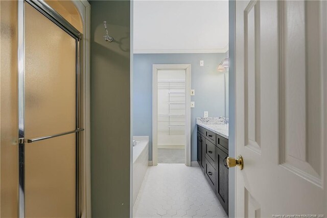 223 Devane St, Fayetteville, NC 28305 - full bathroom with a stall shower, crown molding, a bath, vanity, and tile patterned flooring