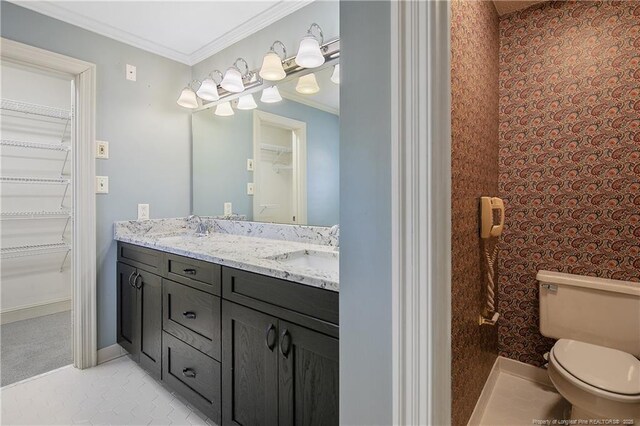 223 Devane St, Fayetteville, NC 28305 - bathroom featuring double vanity, a walk in closet, and crown molding