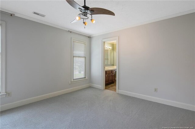 223 Devane St, Fayetteville, NC 28305 - unfurnished bedroom featuring crown molding, light colored carpet, connected bathroom, and ceiling fan