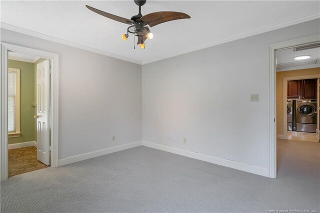 223 Devane St, Fayetteville, NC 28305 - carpeted spare room featuring separate washer and dryer, ceiling fan, and crown molding
