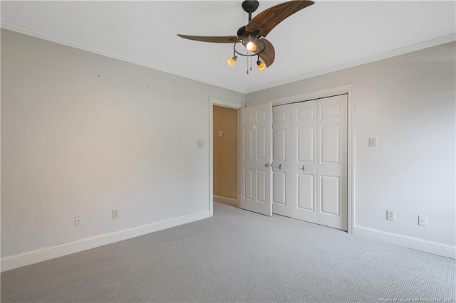 223 Devane St, Fayetteville, NC 28305 - unfurnished bedroom with ornamental molding, a closet, light colored carpet, and a ceiling fan