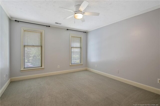 223 Devane St, Fayetteville, NC 28305 - empty room featuring a textured ceiling, healthy amount of natural light, ornamental molding, light carpet, and ceiling fan