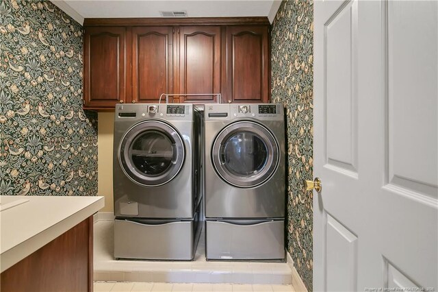 223 Devane St, Fayetteville, NC 28305 - laundry room featuring cabinet space, separate washer and dryer, and wallpapered walls