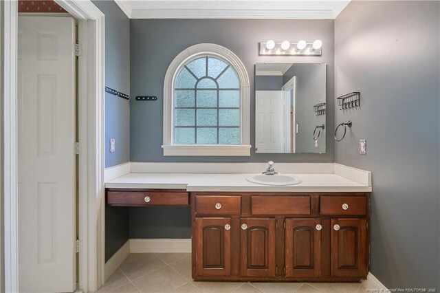 223 Devane St, Fayetteville, NC 28305 - bathroom featuring vanity, ornamental molding, and tile patterned flooring