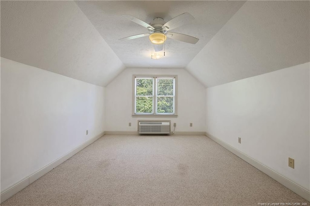 223 Devane St, Fayetteville, NC 28305 - bonus room with a wall unit AC, carpet, lofted ceiling, ceiling fan, and a textured ceiling