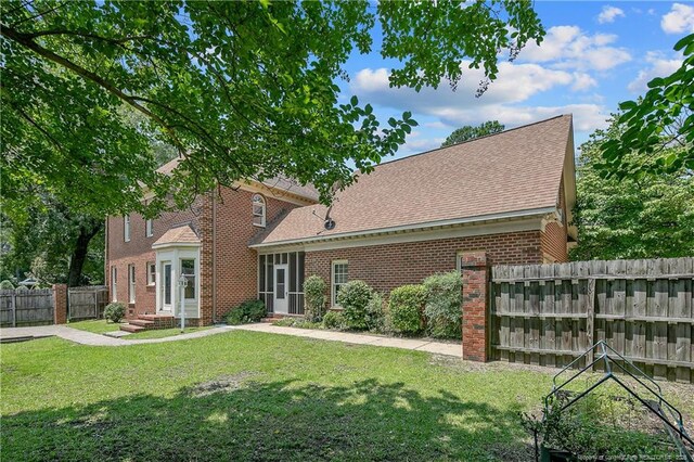 223 Devane St, Fayetteville, NC 28305 - view of front of property with brick siding and roof with shingles